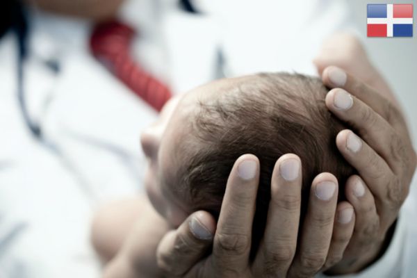 Pediatrician holding a beautiful newborn baby boy