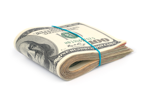 Stack of money- cash of US dollars isolated on white background