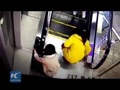 Boy saved by passers-by in escalator scare in SW China